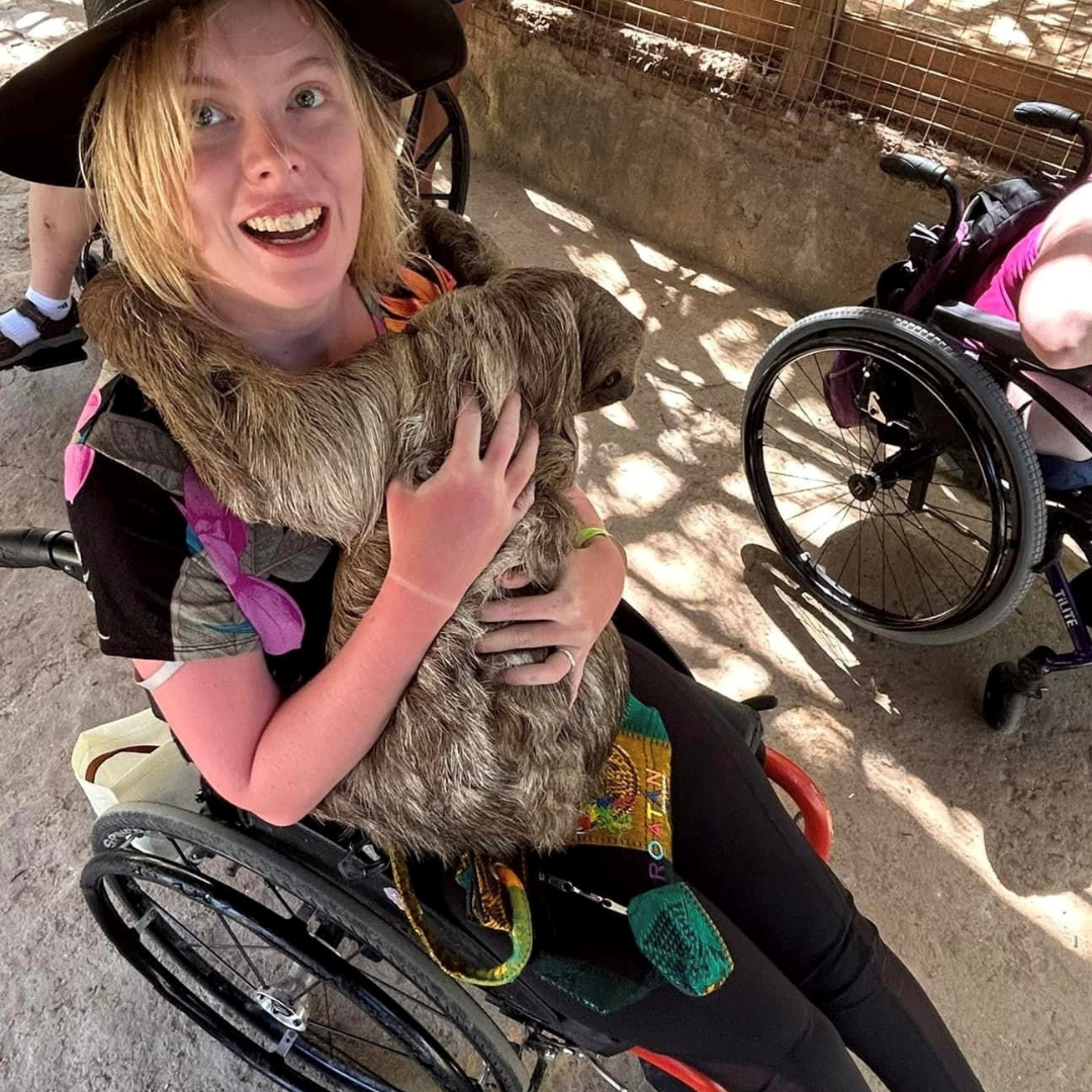 Amanda holding a sloth.