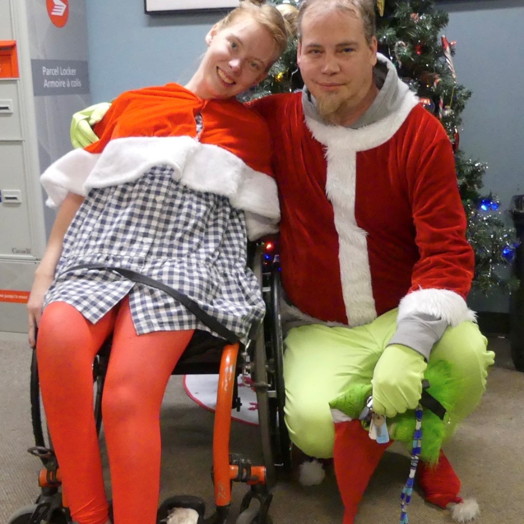 Amanda and her boyfriend dressing up in Christmas clothing.